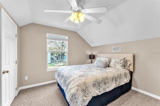 carpeted bedroom featuring ceiling fan and vaulted ceiling