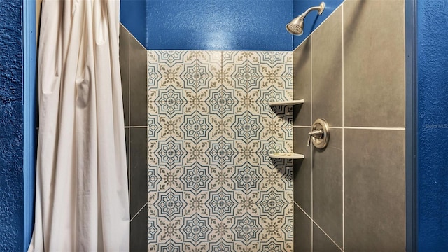 bathroom with a shower with shower curtain