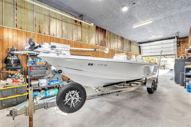 garage featuring wooden walls