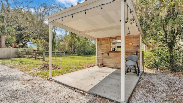 view of patio featuring an outbuilding