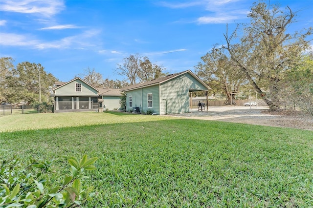 view of yard with a sunroom