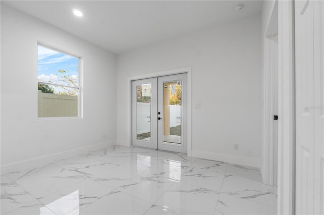 interior space featuring french doors and a healthy amount of sunlight