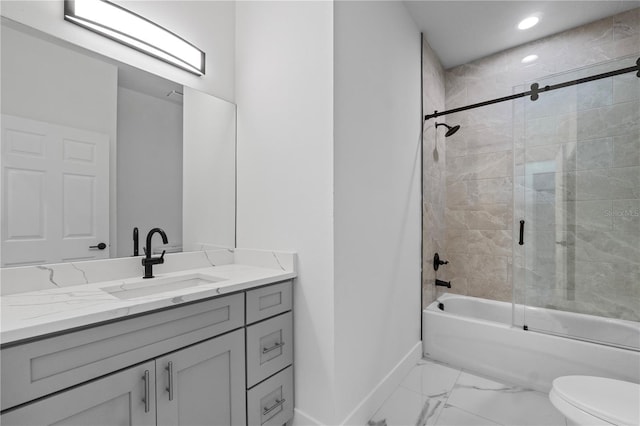 full bathroom featuring bath / shower combo with glass door, vanity, and toilet