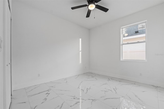 unfurnished room with ceiling fan