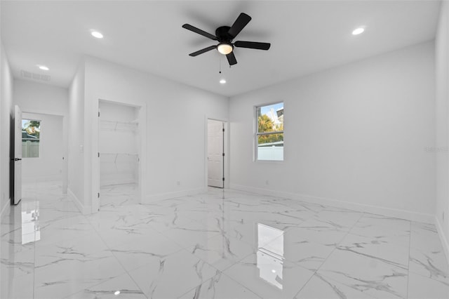 unfurnished room featuring ceiling fan