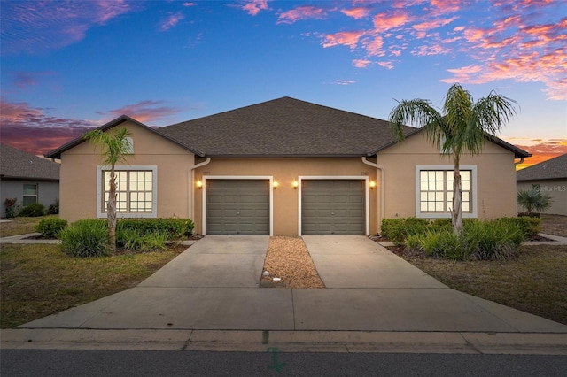 ranch-style home featuring a garage