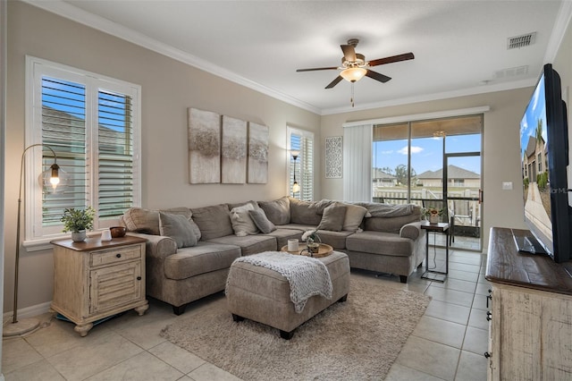 tiled living room featuring crown molding and ceiling fan