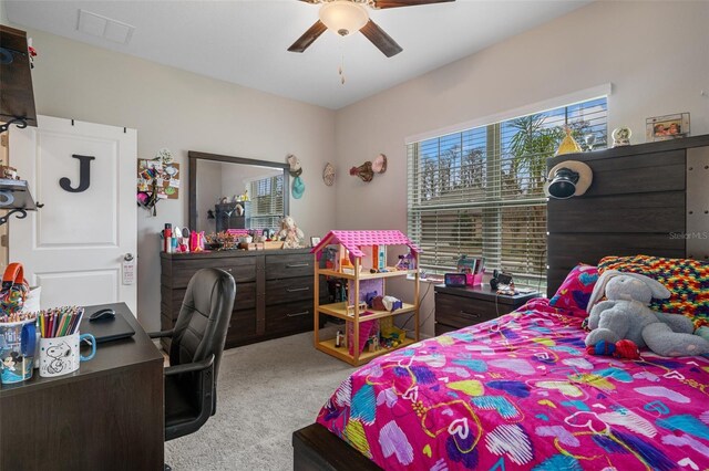 carpeted bedroom with ceiling fan