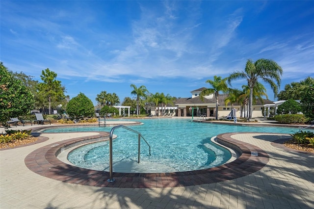 view of swimming pool with a patio area