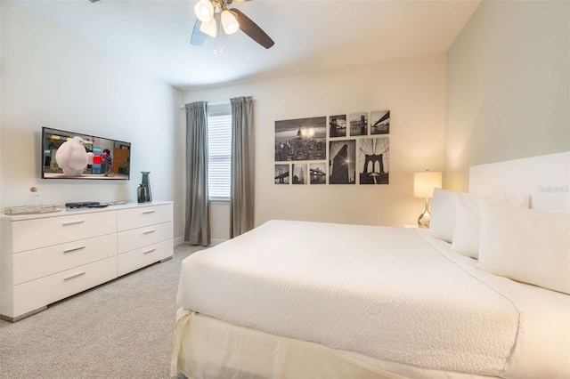 bedroom featuring ceiling fan and light colored carpet