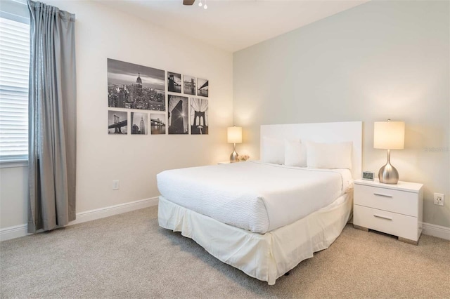 carpeted bedroom featuring ceiling fan