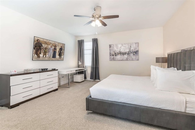 bedroom featuring light carpet and ceiling fan