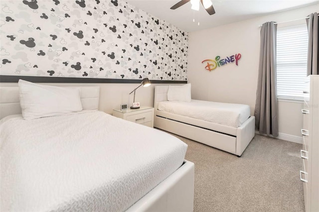 bedroom featuring light colored carpet and ceiling fan