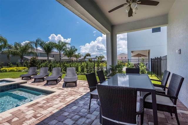 view of patio with ceiling fan and a fenced in pool