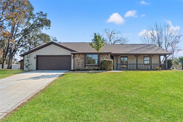 single story home with a garage, covered porch, and a front lawn