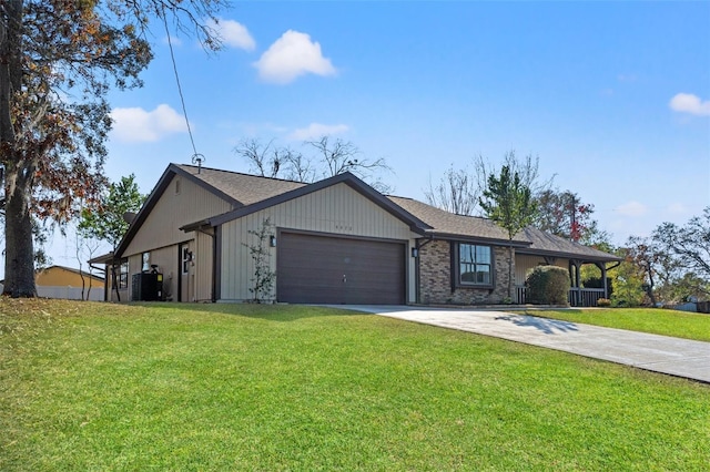 ranch-style house featuring a garage and a front yard