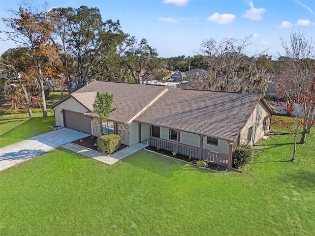 view of front of property featuring a garage and a front yard