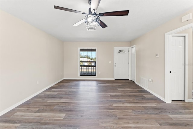 empty room with ceiling fan and hardwood / wood-style floors