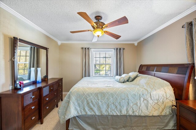 bedroom featuring crown molding, light colored carpet, ceiling fan, and a textured ceiling