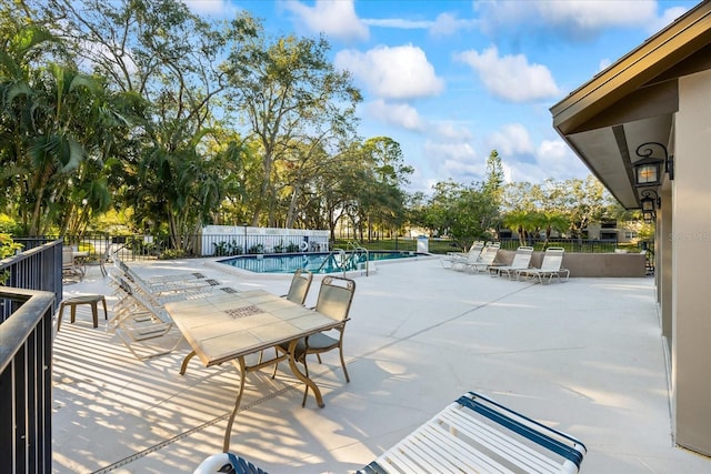 view of swimming pool with a patio area