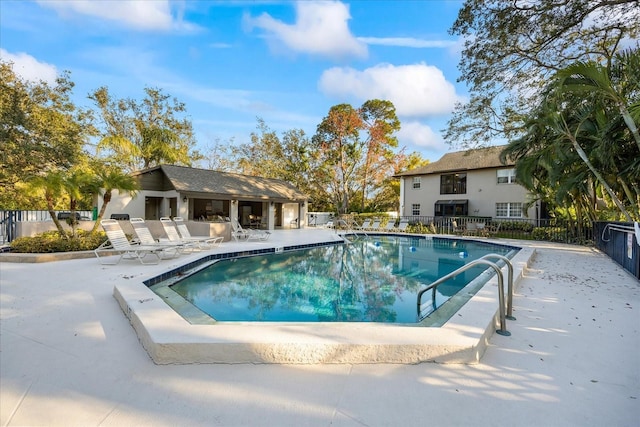 view of swimming pool featuring a patio