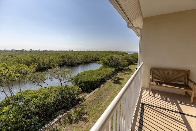 balcony featuring a water view