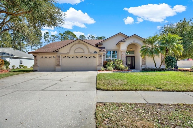 view of front of home featuring a garage and a front lawn