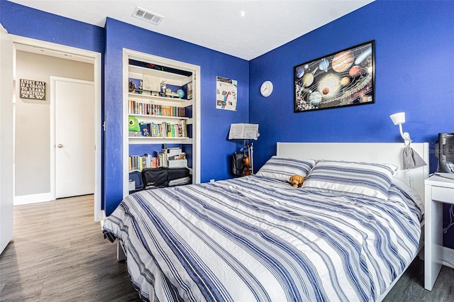 bedroom featuring hardwood / wood-style flooring