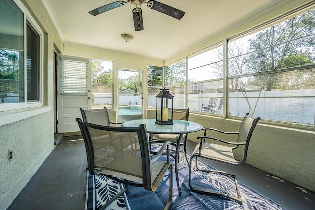 sunroom / solarium with ceiling fan