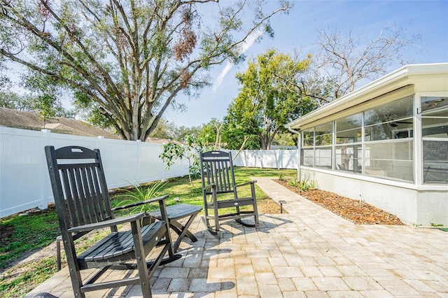 view of patio / terrace with a sunroom