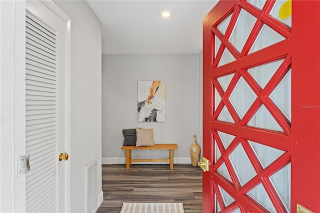 hallway with dark wood-type flooring