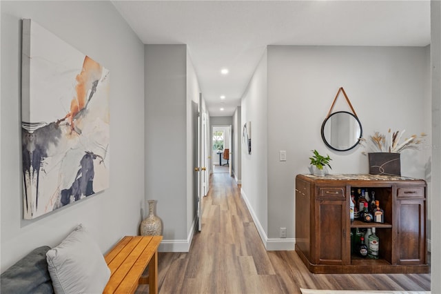 hall with light hardwood / wood-style flooring