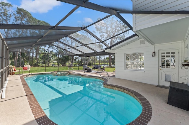 view of swimming pool with a lanai and a patio area