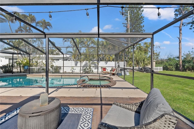 view of swimming pool featuring an in ground hot tub, a yard, a lanai, and a patio area