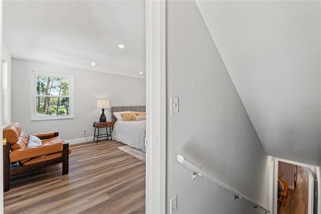 bedroom with hardwood / wood-style flooring