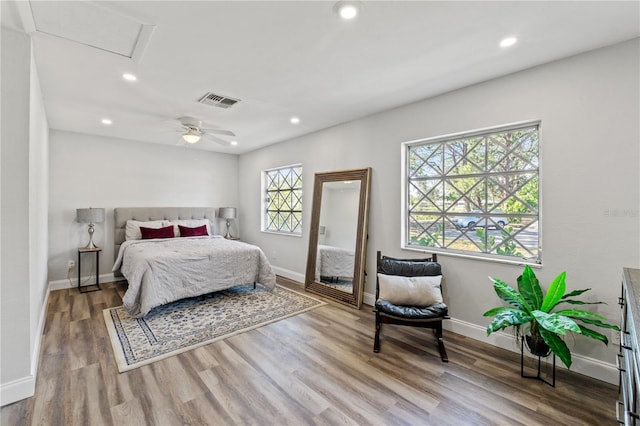 bedroom with hardwood / wood-style flooring and ceiling fan