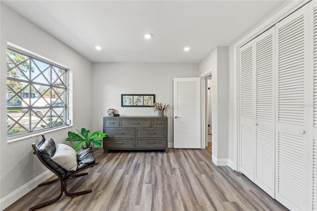 sitting room featuring light hardwood / wood-style flooring