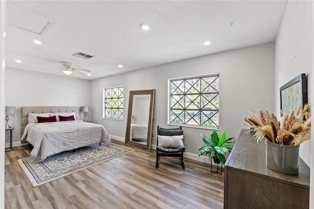 bedroom featuring hardwood / wood-style floors and ceiling fan