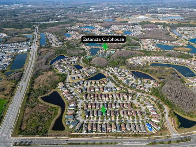 birds eye view of property with a water view