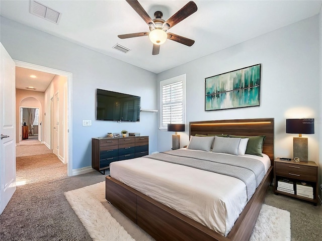 bedroom with light colored carpet and ceiling fan