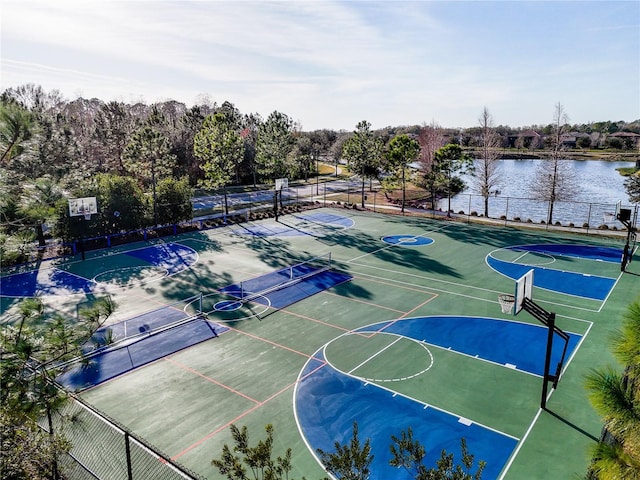 view of basketball court featuring a water view