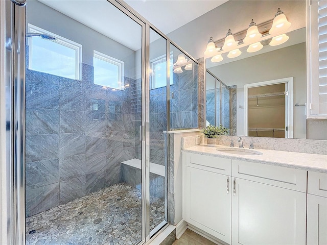 bathroom featuring vanity and walk in shower