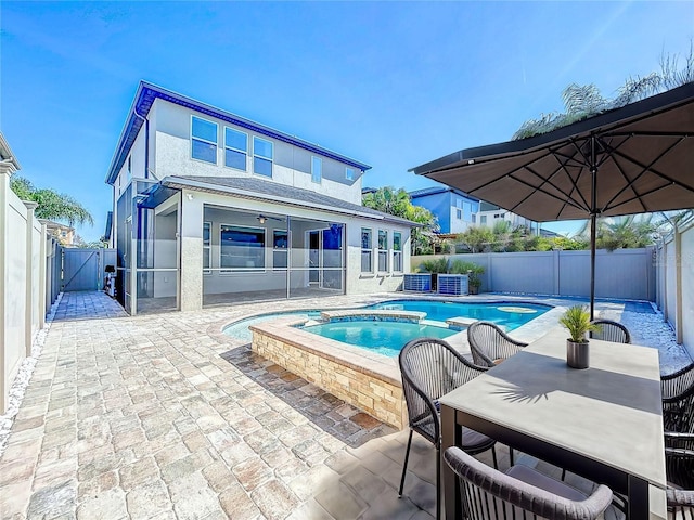 view of swimming pool featuring a patio and an in ground hot tub