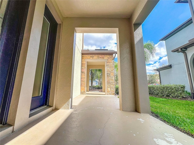 doorway to property with a patio