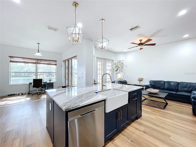 kitchen featuring a kitchen island with sink, sink, pendant lighting, and dishwasher