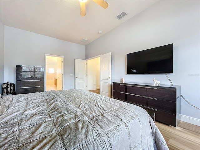 bedroom with vaulted ceiling, ceiling fan, and light hardwood / wood-style flooring