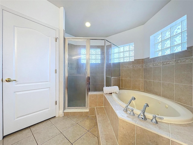 bathroom with tile patterned flooring and independent shower and bath