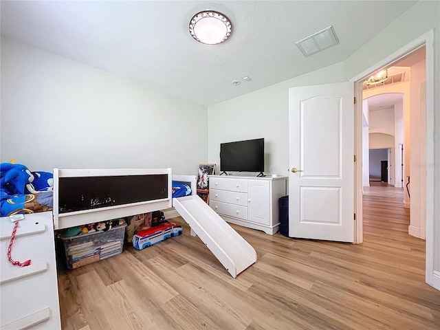 playroom with light hardwood / wood-style flooring