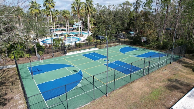 view of basketball court featuring community basketball court and fence