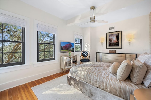 bedroom featuring hardwood / wood-style flooring and ceiling fan